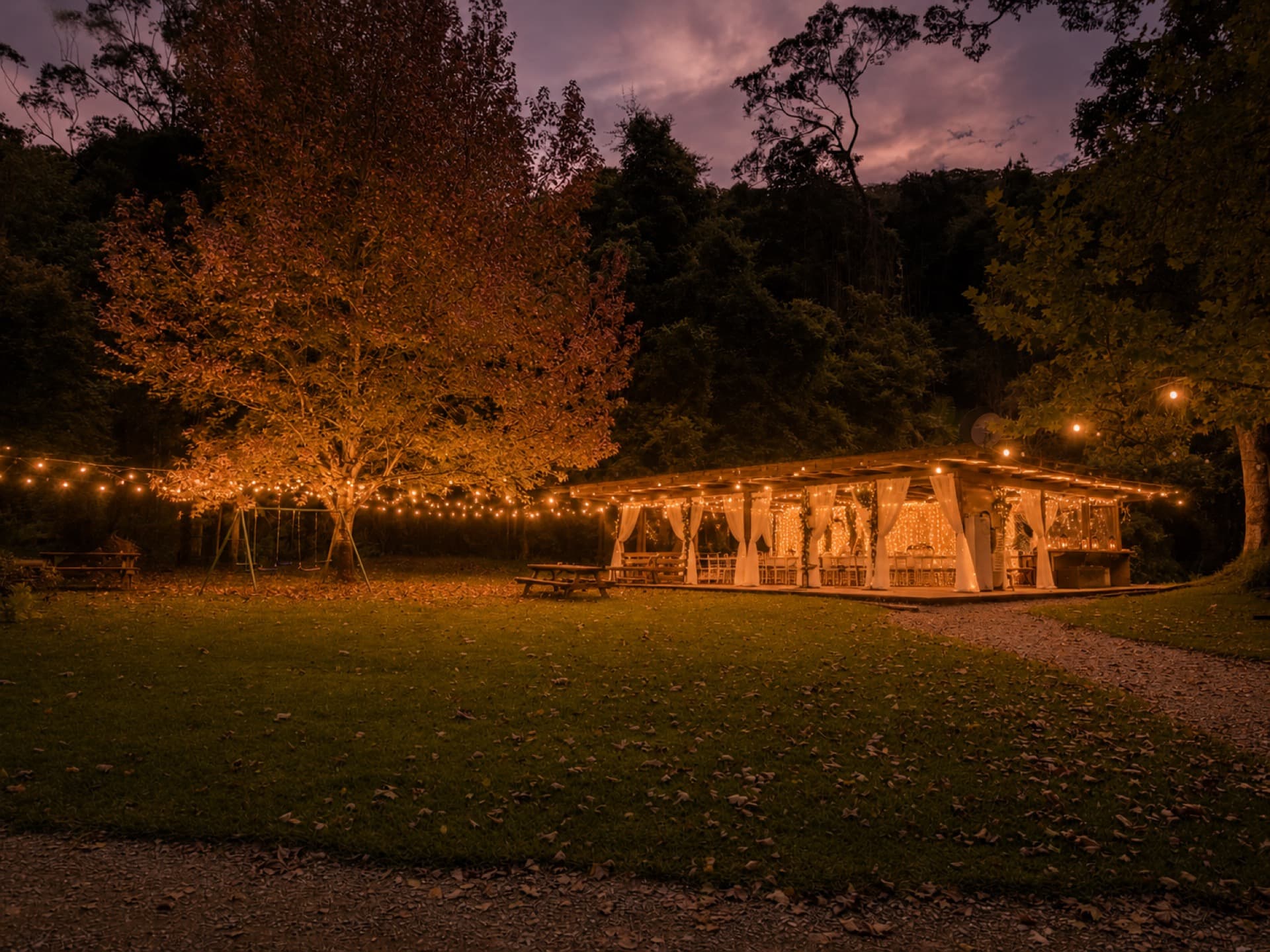 The pavilion lit up at twilight