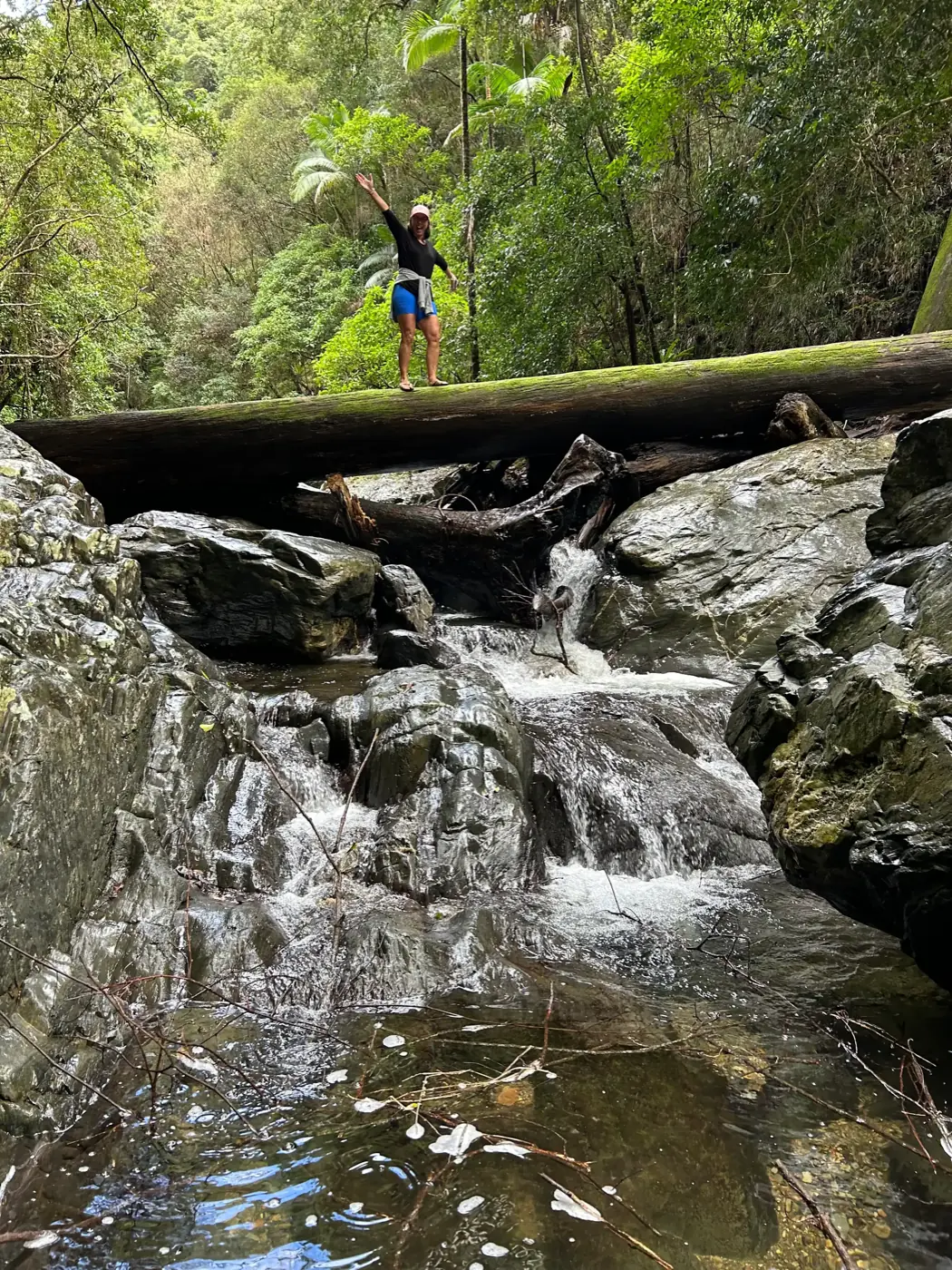 Rock hopping along the creek on the way to the waterfall at Oasis of Hope